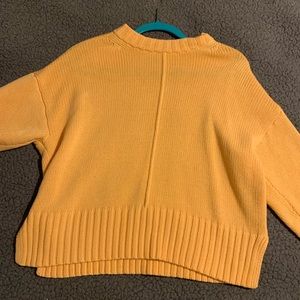 A new day orange sweater
